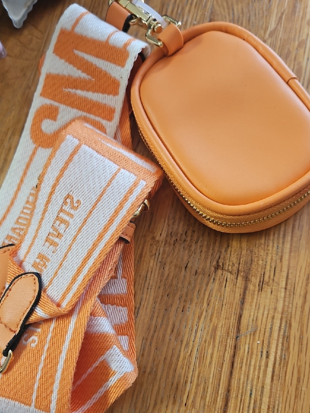 Steve Madden Orange and Cream Woven Logo Strap